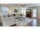 Comfortable living room features plush seating, a fireplace, and plenty of natural light at 3224 White Oak St, Highlands Ranch, CO 80129