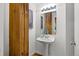 Modern bathroom with a stylish vessel sink and wooden support beam at 1745 Wazee St # 3C, Denver, CO 80202