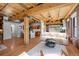 Open concept living area with wood floors and exposed wooden beams at 1745 Wazee St # 3C, Denver, CO 80202