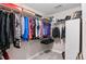 Organized walk-in closet with shelving and hanging space for clothing and accessories at 201 Shenandoah Way, Brighton, CO 80603