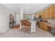 Bright kitchen featuring light wood cabinetry, modern appliances, and an open layout at 201 Shenandoah Way, Brighton, CO 80603
