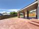 Covered patio area showcasing stone columns and a stained concrete patio perfect for outdoor relaxation at 17212 E Oberlin Pl, Aurora, CO 80013