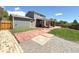 Home with stone patio, newly installed sod, privacy fence, and gravel walkway at 17212 E Oberlin Pl, Aurora, CO 80013