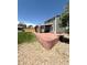 Spacious backyard featuring a covered patio with stone pillars and a well-maintained lawn at 17212 E Oberlin Pl, Aurora, CO 80013