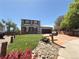 Charming two-story home with a well-manicured lawn and colorful landscaping at 17212 E Oberlin Pl, Aurora, CO 80013