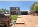 Charming home with a brick and siding facade and a spacious driveway leading to a two-car garage at 17212 E Oberlin Pl, Aurora, CO 80013