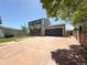 Charming home with a brick and siding facade and a spacious driveway leading to a two-car garage at 17212 E Oberlin Pl, Aurora, CO 80013