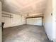 Spacious two-car garage with shelving offering ample storage and parking space at 17212 E Oberlin Pl, Aurora, CO 80013