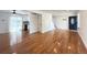 Bright living room with hardwood floors, neutral walls, and direct access to kitchen at 17212 E Oberlin Pl, Aurora, CO 80013