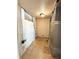 Small utility room with concrete wall, tiled floor, and utilities visible at 17212 E Oberlin Pl, Aurora, CO 80013