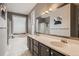 Full bathroom features a double vanity, bathtub, and walk-in shower at 5136 S Ceylon St, Centennial, CO 80015