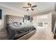 Relaxing bedroom boasts a tufted headboard and stylish decor at 5136 S Ceylon St, Centennial, CO 80015