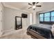 Bedroom features carpet and a large mirror at 5136 S Ceylon St, Centennial, CO 80015