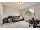 Neutral bedroom showcasing a large window for natural light, and neutral carpet at 5136 S Ceylon St, Centennial, CO 80015