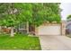Charming two-story home with stone accents and a two-car garage enhancing its curb appeal at 5136 S Ceylon St, Centennial, CO 80015