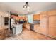 A spacious eat-in kitchen with stainless steel appliances and backsplash at 5136 S Ceylon St, Centennial, CO 80015