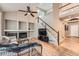Open-concept living room with fireplace at 5136 S Ceylon St, Centennial, CO 80015