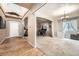 Bright, open office space features a glass desk, hardwood floor, and decor for atmosphere at 5136 S Ceylon St, Centennial, CO 80015
