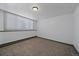 Simple, minimalist bedroom with carpeted floors and window providing natural light at 8092 S Jay Dr, Littleton, CO 80128