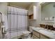 Cozy bathroom with a shower-tub combination and granite countertop vanity at 1727 Pearl St # 205, Denver, CO 80203