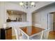 Dining area showcases a dining table with seating for four, hardwood floors, and nice lighting at 1727 Pearl St # 205, Denver, CO 80203