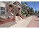 Brick building featuring an inviting entrance with staircase and well-maintained landscaping at 1727 Pearl St # 205, Denver, CO 80203