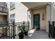 Charming unit entrance with door number, potted plants, and a decorative welcome mat at 1727 Pearl St # 205, Denver, CO 80203