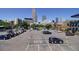 Parking lot with multiple cars with views of the city skyline in the background at 1727 Pearl St # 205, Denver, CO 80203