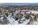 An aerial view of a home in a snow covered neighborhood at 6144 S Fulton St, Englewood, CO 80111