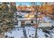 Snow covered home with a large backyard, and a neighborhood view at 6144 S Fulton St, Englewood, CO 80111