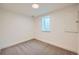 Finished basement bedroom with neutral carpeting and a window for natural light at 6144 S Fulton St, Englewood, CO 80111