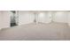 Spacious finished basement with neutral carpeting and a full bathroom at 6144 S Fulton St, Englewood, CO 80111