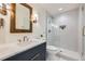 Spa-like bathroom with walk-in shower and marble vanity at 6144 S Fulton St, Englewood, CO 80111