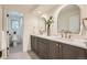 Elegant bathroom with double vanity and a large mirror at 6144 S Fulton St, Englewood, CO 80111