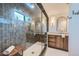 Spa-like bathroom with a walk-in shower and a bench at 6144 S Fulton St, Englewood, CO 80111