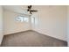 Comfortable bedroom with carpet, ceiling fan and window at 6144 S Fulton St, Englewood, CO 80111