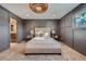 Bright bedroom with carpeted floor and modern lighting at 6144 S Fulton St, Englewood, CO 80111