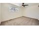 Simple bedroom with carpet, ceiling fan, and window at 6144 S Fulton St, Englewood, CO 80111