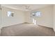 Light and airy bedroom with a ceiling fan and window at 6144 S Fulton St, Englewood, CO 80111