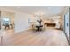 Modern dining room with a large table and access to kitchen at 6144 S Fulton St, Englewood, CO 80111