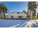 Rear view of the house showcasing a modern design and large deck at 6144 S Fulton St, Englewood, CO 80111