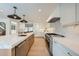 Bright kitchen boasts marble countertops and high-end appliances at 6144 S Fulton St, Englewood, CO 80111