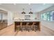 Open kitchen with large island and seating for four at 6144 S Fulton St, Englewood, CO 80111