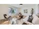 Light-filled living room featuring a comfy sofa and large windows at 6144 S Fulton St, Englewood, CO 80111