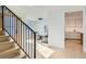 Elegant staircase with metal railing and hardwood steps at 6144 S Fulton St, Englewood, CO 80111