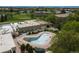 Aerial shot of the community pool surrounded by greenery near the residential buildings at 9150 E Center Ave # 7C, Denver, CO 80247
