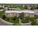 Overhead view of the residences showcasing well-manicured lawns, mature trees, and ample parking at 9150 E Center Ave # 7C, Denver, CO 80247