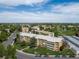 Overhead view of the residences showcasing well-manicured lawns, mature trees, and ample parking at 9150 E Center Ave # 7C, Denver, CO 80247