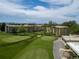Scenic aerial view overlooking meticulously maintained golf course and lush landscaping surrounding residential buildings at 9150 E Center Ave # 7C, Denver, CO 80247