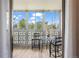 Cozy balcony area featuring a glass table and two black chairs, with a view at 9150 E Center Ave # 7C, Denver, CO 80247